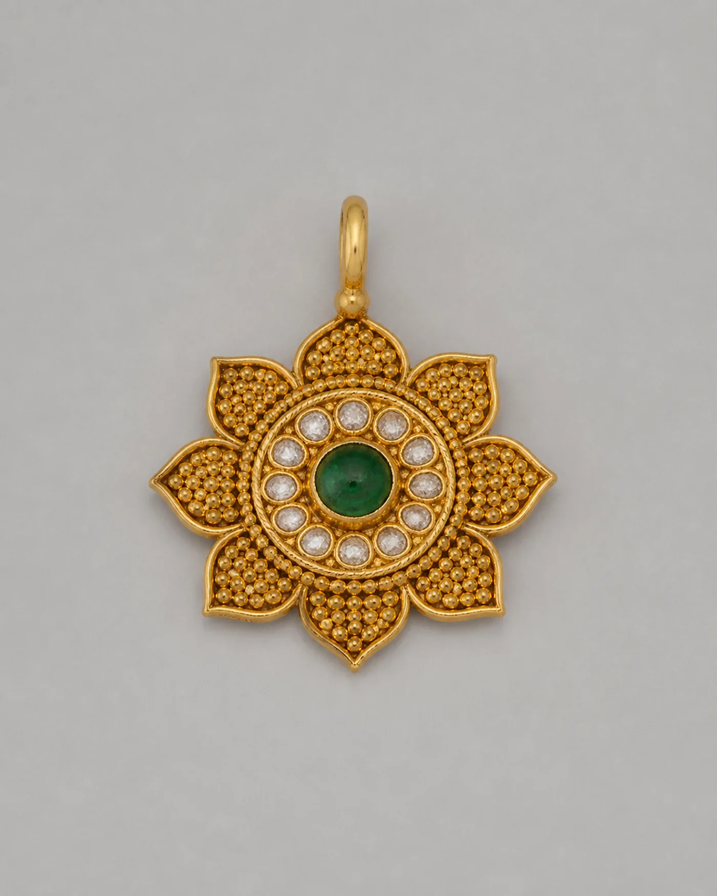 Eight-petalled gold lotus pendant, granulated throughout, ringed with polki around a cabochon emerald